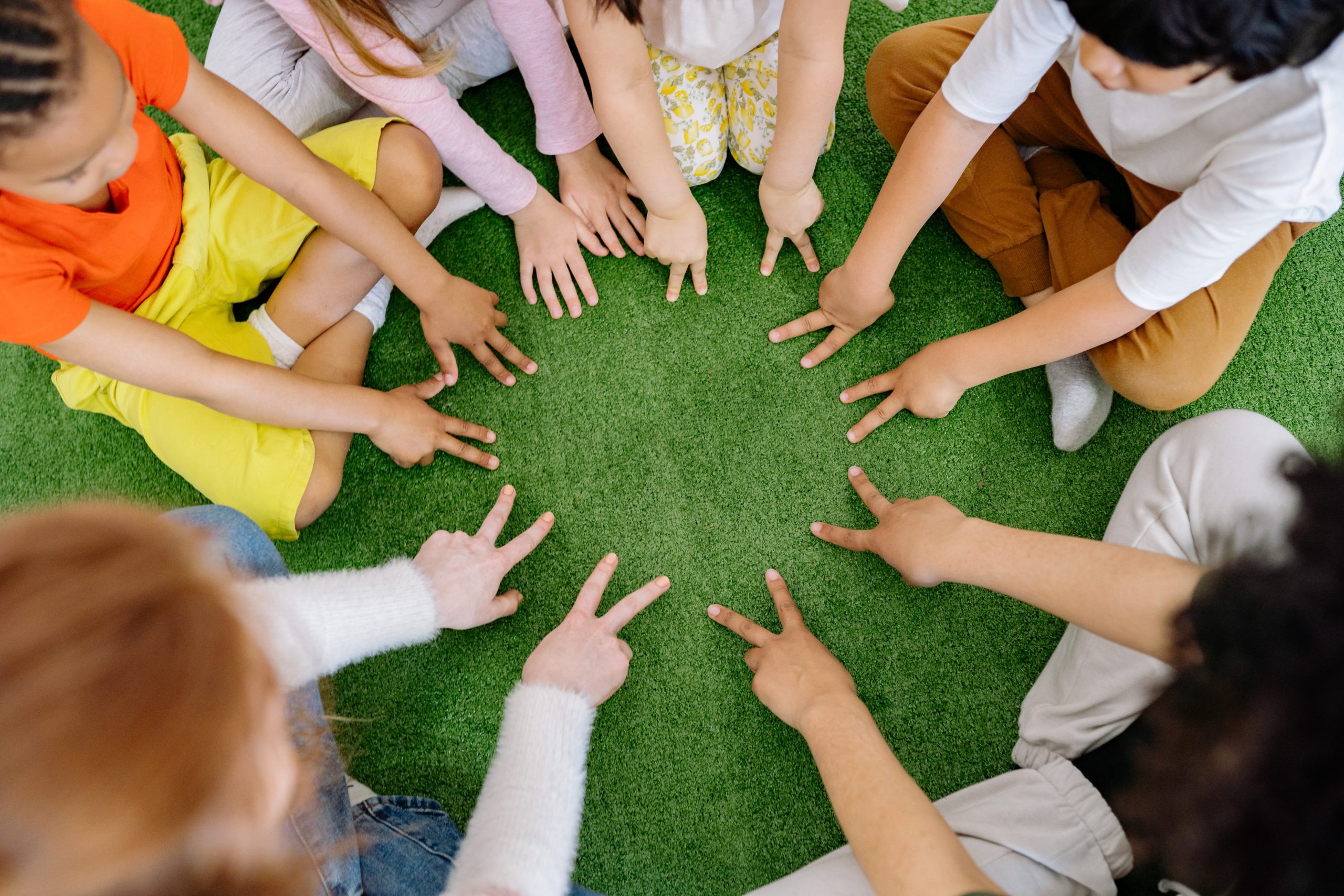 Mental health for youth image with children sitting in a circle